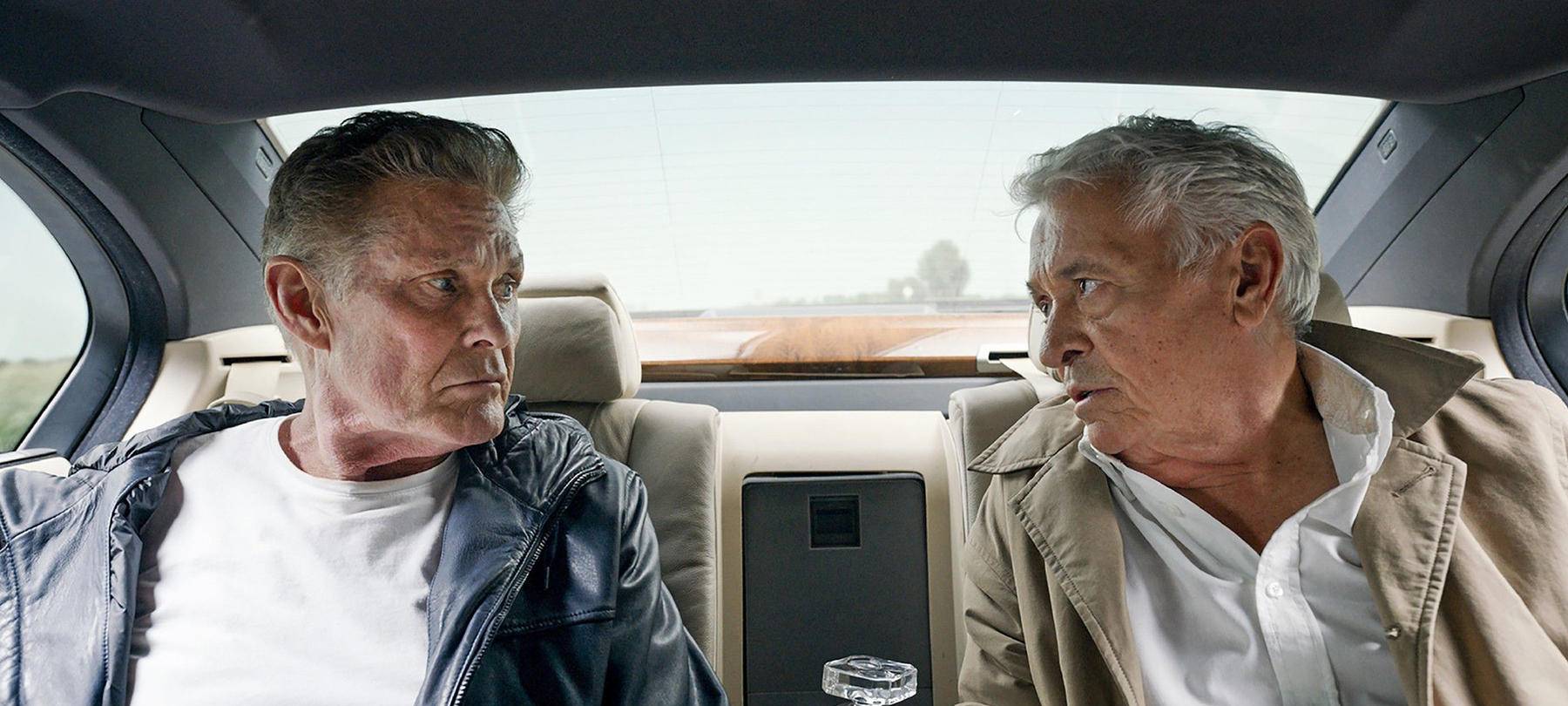 Hasselhoff und Hübchen im Auto.